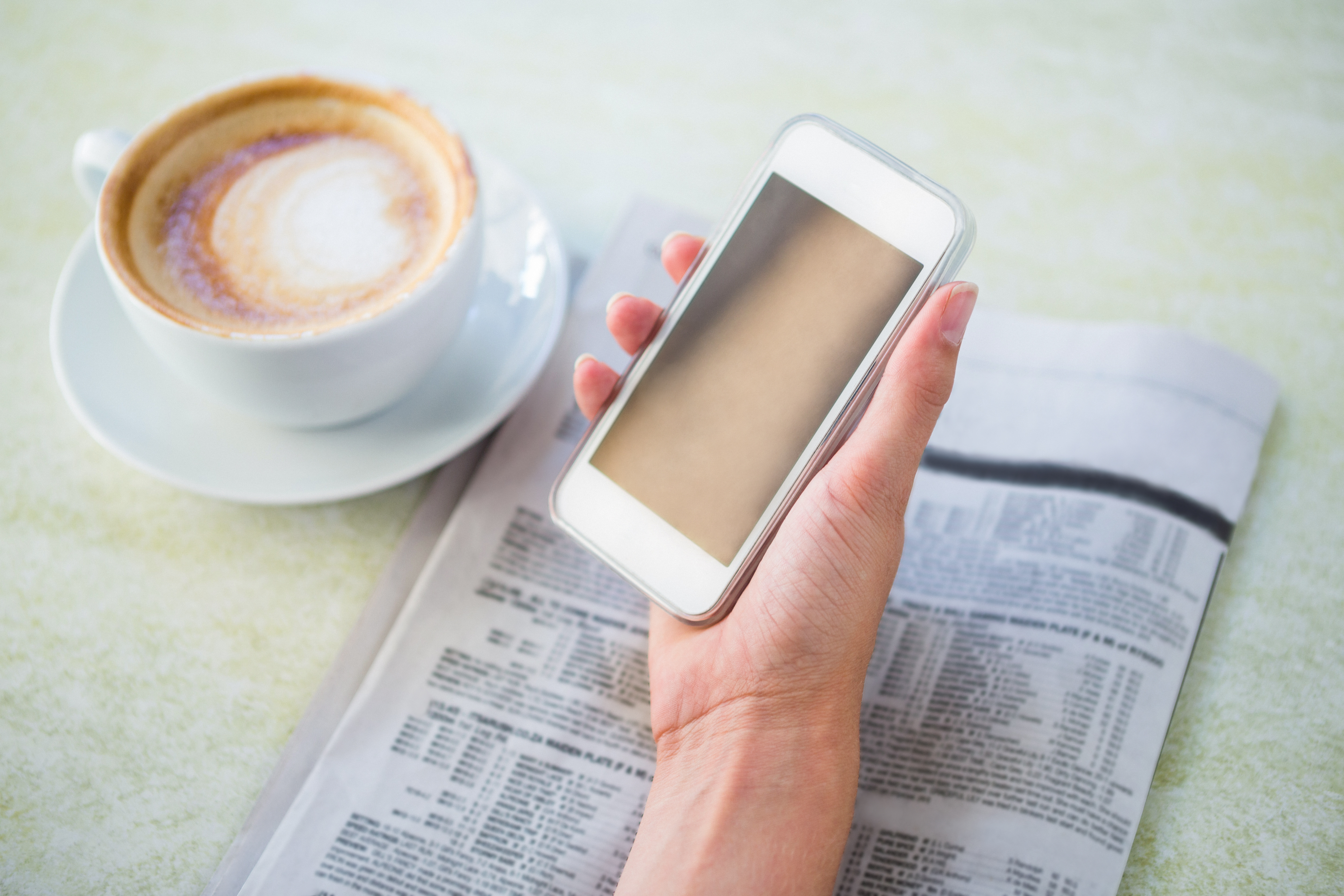 coffee, phone and newspaper